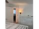 Bedroom showcasing a dresser and a peek into another bedroom at 874 Baveno Dr, Venice, FL 34285