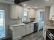 Beautiful kitchen features stainless steel appliances, granite countertops, and ample storage at 874 Baveno Dr, Venice, FL 34285