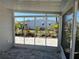 Spacious screened-in lanai with beautiful outdoor views, perfect for enjoying the natural surroundings at 874 Baveno Dr, Venice, FL 34285