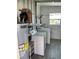 Laundry room with washer, dryer, and storage at 874 Baveno Dr, Venice, FL 34285