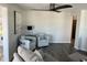 Comfortable seating area with chairs, lamp, and artwork, creating a relaxing atmosphere at 874 Baveno Dr, Venice, FL 34285