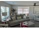 Comfortable living room with lots of natural light and seating at 874 Baveno Dr, Venice, FL 34285