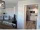 Bright open living area with view of the updated kitchen at 874 Baveno Dr, Venice, FL 34285