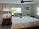 Main bedroom boasts ceiling fan, natural light, and stylish décor at 874 Baveno Dr, Venice, FL 34285