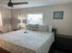 Main bedroom featuring ceiling fan and natural light from the window at 874 Baveno Dr, Venice, FL 34285