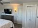 Bedroom with a TV and a large closet with a double door at 874 Baveno Dr, Venice, FL 34285