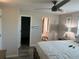 Bright bedroom featuring a ceiling fan and en suite bathroom for added convenience at 874 Baveno Dr, Venice, FL 34285