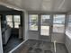 View of sunroom entrance from living room offering great natural light and outside access at 874 Baveno Dr, Venice, FL 34285