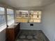 Bright sunroom with multiple windows offering outdoor views, featuring a dresser at 874 Baveno Dr, Venice, FL 34285