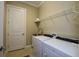 Laundry room with washer, dryer, and a utility sink at 10319 Medjool Dr, Venice, FL 34293