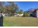 Large backyard with lush lawn, providing ample space for recreation at 1035 N Race St, North Port, FL 34286