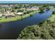 Community with waterfront properties and lush greenery at 1226 Pine Needle Rd, Venice, FL 34285