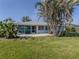 Charming home with a screened patio and lush landscaping at 1226 Pine Needle Rd, Venice, FL 34285