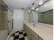 Bathroom with vintage checkerboard floor and updated vanity at 1226 Pine Needle Rd, Venice, FL 34285