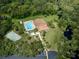 Aerial view of community pool, shuffleboard, and clubhouse at 1226 Pine Needle Rd, Venice, FL 34285