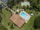 Aerial view shows community pool, clubhouse, and recreational areas at 1226 Pine Needle Rd, Venice, FL 34285