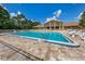 Relaxing community pool with lounge chairs and clubhouse view at 1226 Pine Needle Rd, Venice, FL 34285