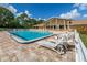 Inviting community pool with plenty of lounge chairs at 1226 Pine Needle Rd, Venice, FL 34285