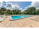 Enjoy this refreshing community pool with surrounding lounge chairs at 1226 Pine Needle Rd, Venice, FL 34285