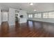 Open living area with hardwood floors and kitchen at 1226 Pine Needle Rd, Venice, FL 34285