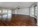 Spacious living room with hardwood floors and multiple windows at 1226 Pine Needle Rd, Venice, FL 34285