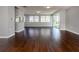 Open concept living area with hardwood floors and access to patio at 1226 Pine Needle Rd, Venice, FL 34285