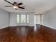 Spacious living room featuring hardwood floors and bay window at 1226 Pine Needle Rd, Venice, FL 34285