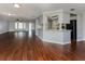 Spacious living area with wood-look floors and access to kitchen at 1226 Pine Needle Rd, Venice, FL 34285