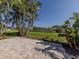 Spacious paver patio with serene canal view at 1226 Pine Needle Rd, Venice, FL 34285
