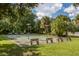 Shuffleboard courts with benches in a shady area at 1226 Pine Needle Rd, Venice, FL 34285