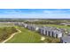 Aerial view of community with condos near golf course at 12280 Wellen Golf St # 108, Venice, FL 34293