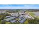 Aerial view of community pool and courts at 12280 Wellen Golf St # 108, Venice, FL 34293