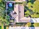 Aerial view of house, detached shed, and nicely landscaped yard at 1237 Schooner Ln, Venice, FL 34285