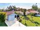 Light blue house with spacious yard and palm trees at 1237 Schooner Ln, Venice, FL 34285