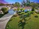 Attractive light blue house with a well-manicured lawn and driveway at 1237 Schooner Ln, Venice, FL 34285