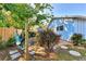 Relaxing backyard with hammock, patio, and lush landscaping at 1237 Schooner Ln, Venice, FL 34285