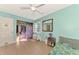 Bedroom with a lavender dresser and closet, featuring a ceiling fan at 1237 Schooner Ln, Venice, FL 34285