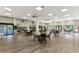 Bright and airy community room, featuring multiple seating areas and large windows at 1237 Schooner Ln, Venice, FL 34285