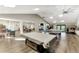 Spacious community room with seating area and game tables at 1237 Schooner Ln, Venice, FL 34285