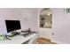 Home office features a workspace with computer and a view into the bedroom at 1237 Schooner Ln, Venice, FL 34285