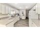 Bright kitchen with white cabinets and granite countertops at 1237 Schooner Ln, Venice, FL 34285