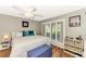 Comfortable main bedroom with king bed, ceiling fan, and plenty of natural light at 1237 Schooner Ln, Venice, FL 34285