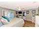 Spacious main bedroom with a king-size bed and access to patio at 1237 Schooner Ln, Venice, FL 34285