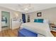 Bright bedroom with king-size bed, and built-in storage at 1237 Schooner Ln, Venice, FL 34285