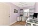 Home office with built-in shelves, desk, and window at 1237 Schooner Ln, Venice, FL 34285