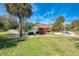 Community pool with surrounding landscaping and a walkway at 1237 Schooner Ln, Venice, FL 34285