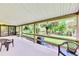 Relaxing covered porch overlooking tranquil waterway at 1237 Schooner Ln, Venice, FL 34285