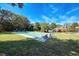Community shuffleboard court with benches under a sunny sky at 1237 Schooner Ln, Venice, FL 34285