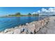 View of Venice waterway with rocks and calm water at 1237 Schooner Ln, Venice, FL 34285