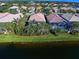 Houses with screened lanais overlooking a calm canal at 13477 Coluccio St, Venice, FL 34293